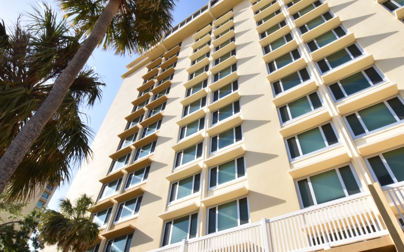 Trinity Towers East building and palm trees