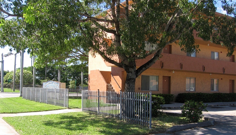 Campbell Arms Apartments fence and building exterior
