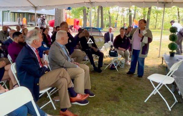 Resident Luz Ramos speaks at event
