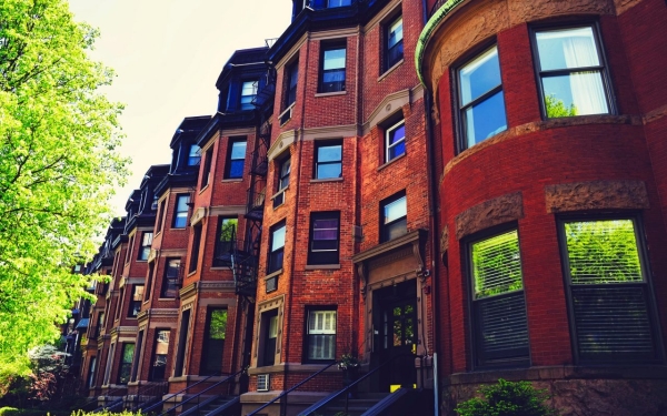 Housing lines the street of a classic Boston neighborhood. Photo via Pixabay