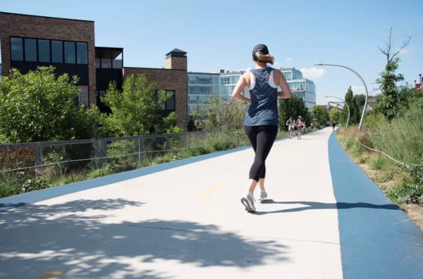 Woman running down path